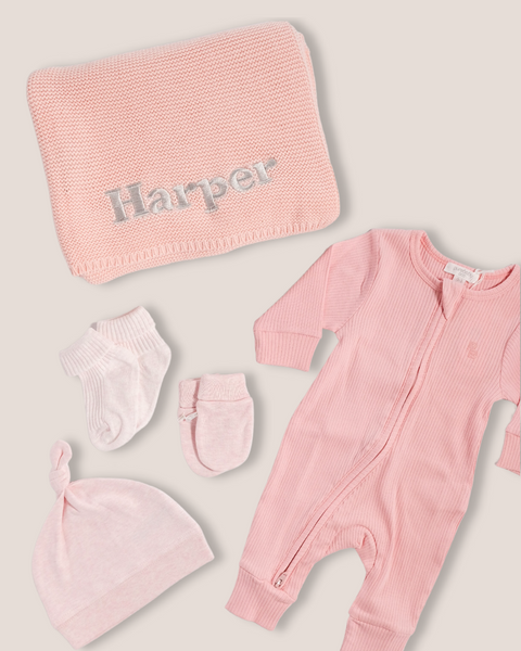 colour:dusty-rose | Flat-lay of personalised dusty rose welcome baby gift set