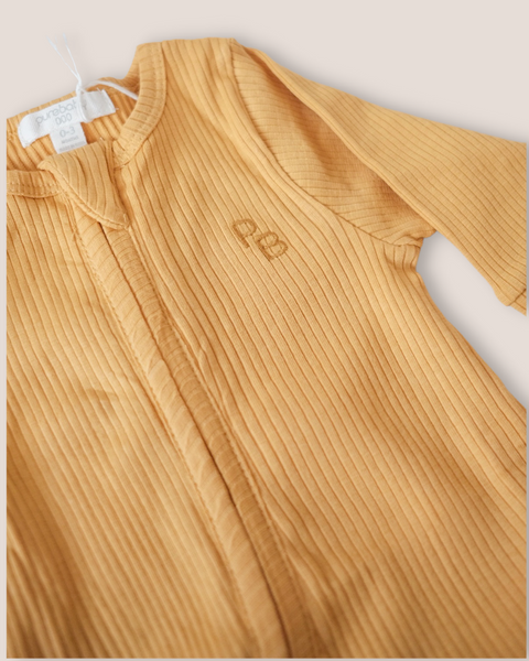 colour:golden | Texture detail of golden mustard ribbed zip baby romper
