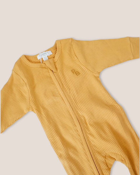 colour:golden | Close-up of golden mustard footed zip baby romper