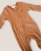 colour:chocolate | Close-up of chocolate brown footed zip baby romper
