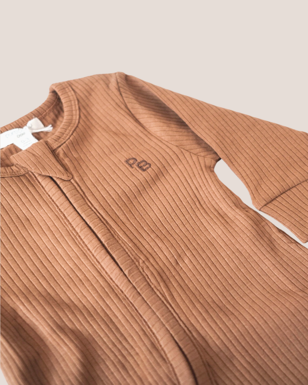 colour:chocolate | Texture detail of chocolate brown ribbed baby romper