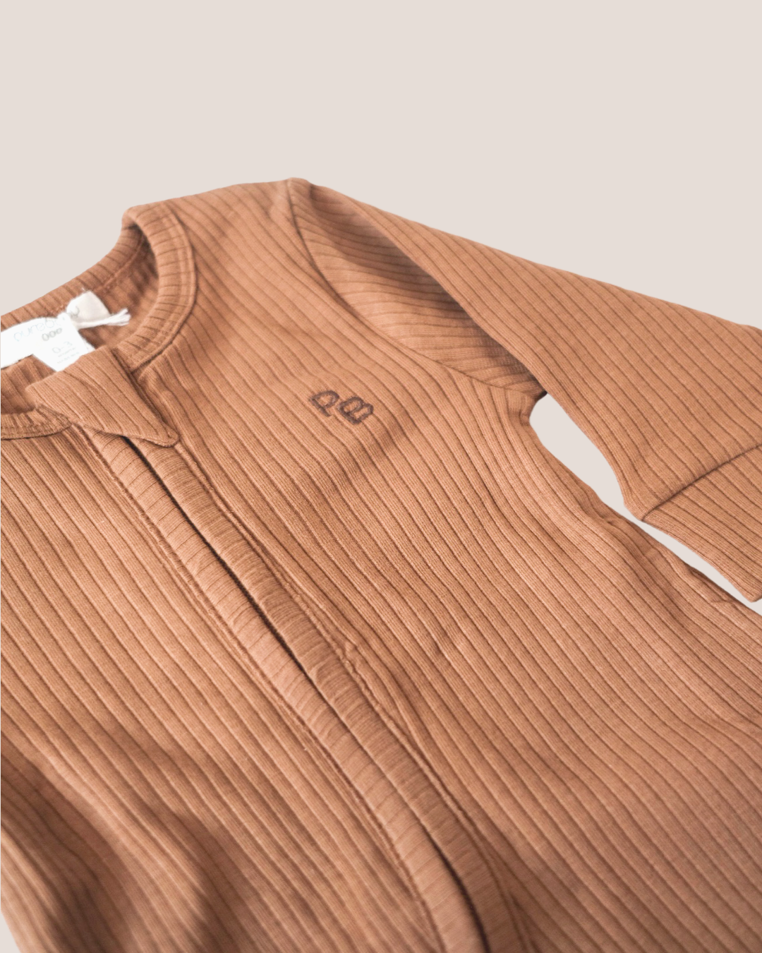 colour:chocolate | Texture detail of chocolate brown ribbed baby romper