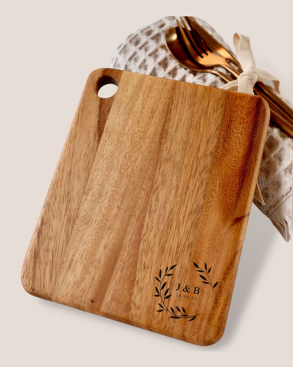 Personalised acacia cheeseboard flat lay with J&B wreath engraving and rose gold cutlery – housewarming wedding gift hamper Australia