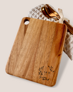 Personalised acacia cheeseboard flat lay with J&B wreath engraving and rose gold cutlery – housewarming wedding gift hamper Australia