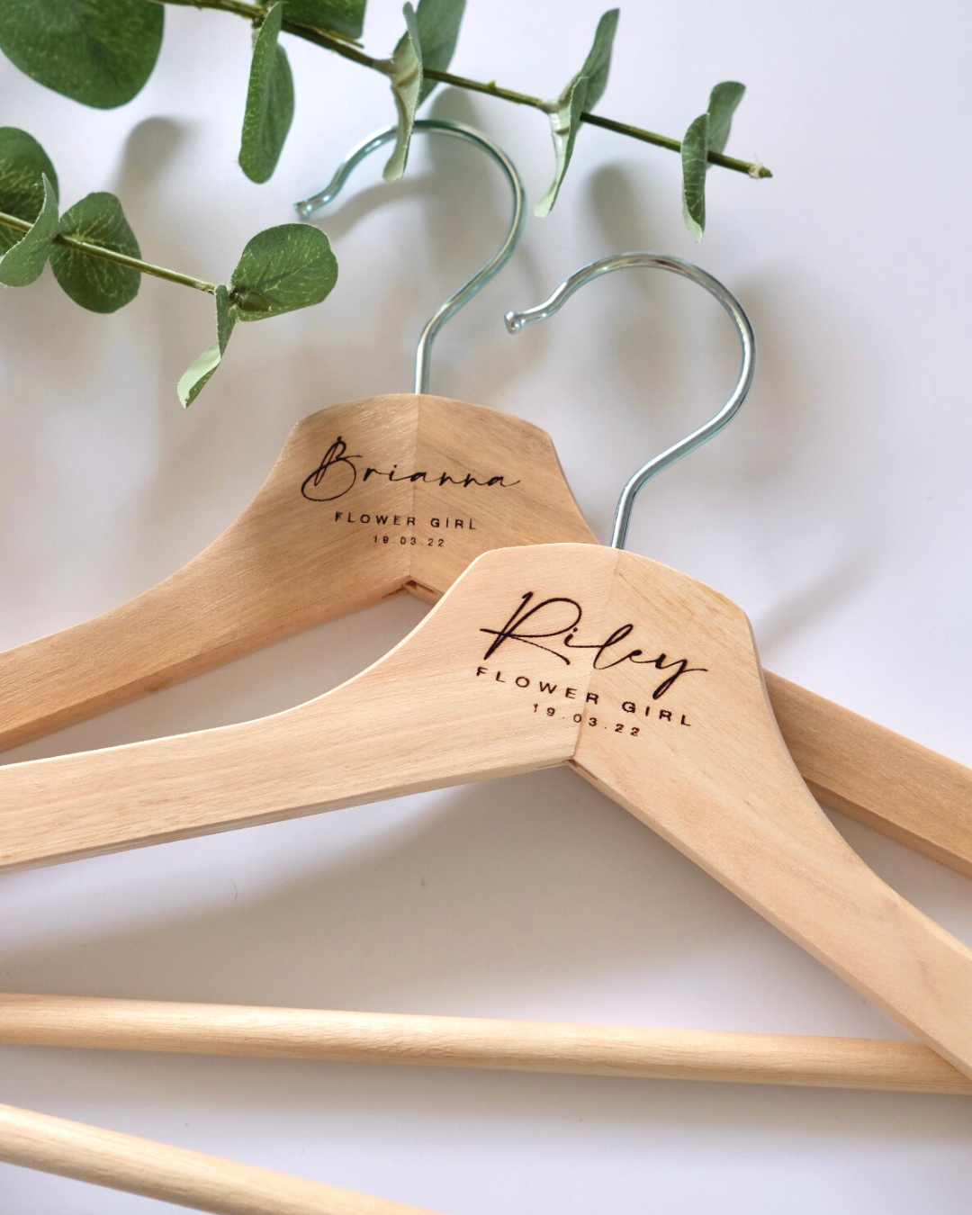 Personalised laser engraved wooden coat hangers for flower girls Brianna and Riley with eucalyptus – wedding party gift Australia