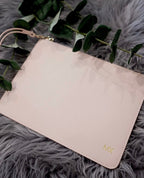 Close-up of personalised monogrammed leather clutch with gold MX initials engraving – custom bridesmaid gift Australia