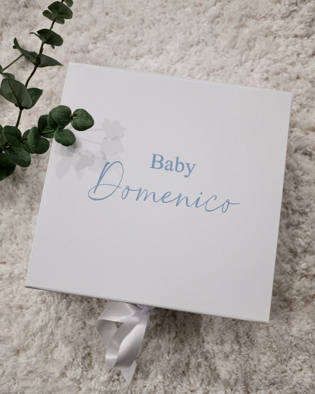 White personalised gift box with baby name Domenico in blue script and white ribbon bow – luxury newborn gift box packaging Australia